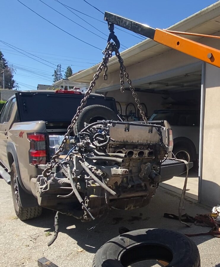 K-Series engine suspended from an engine hoist mounted on a truck bed
