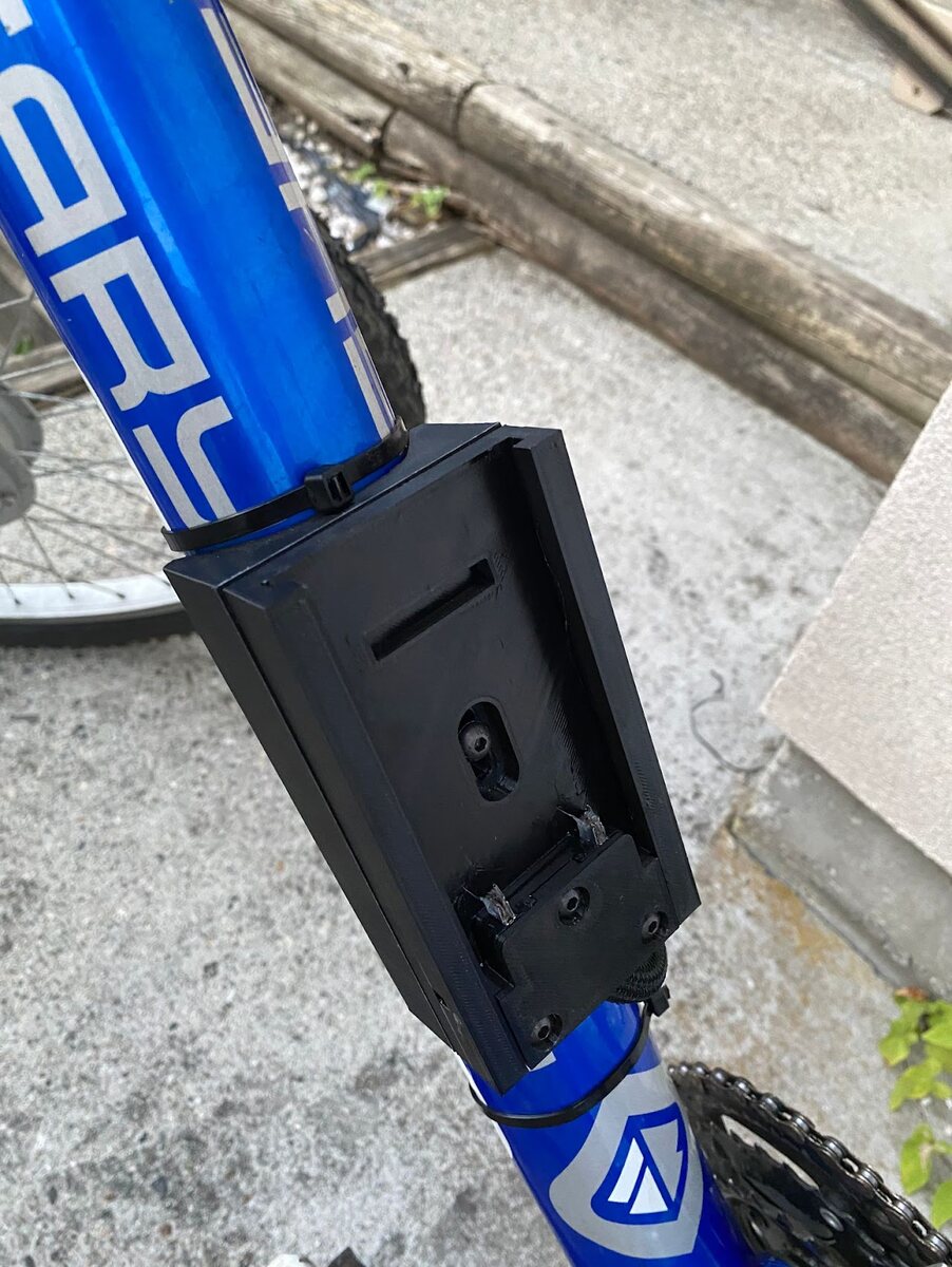 3D-printed battery mount installed on bike.